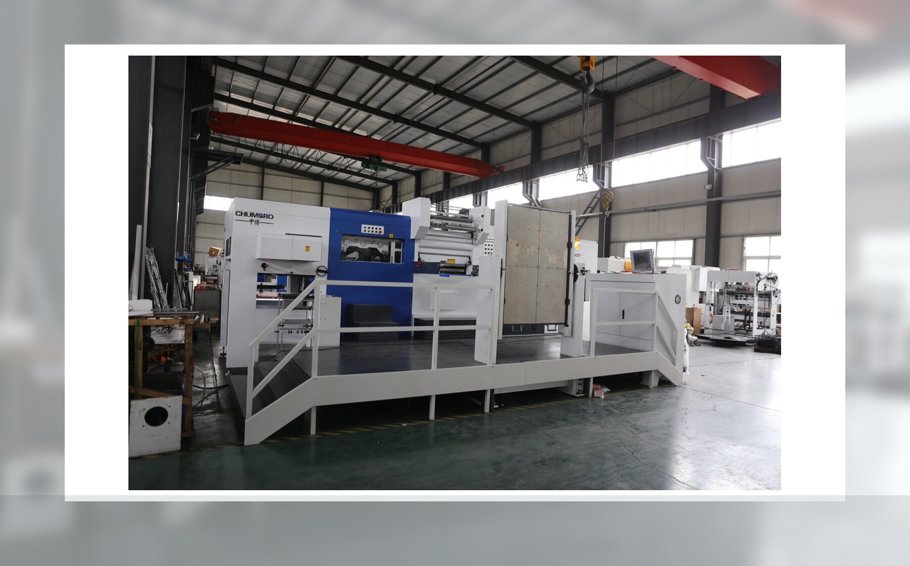 Automatic flatbed die cutting machine for paperboard and carton work
