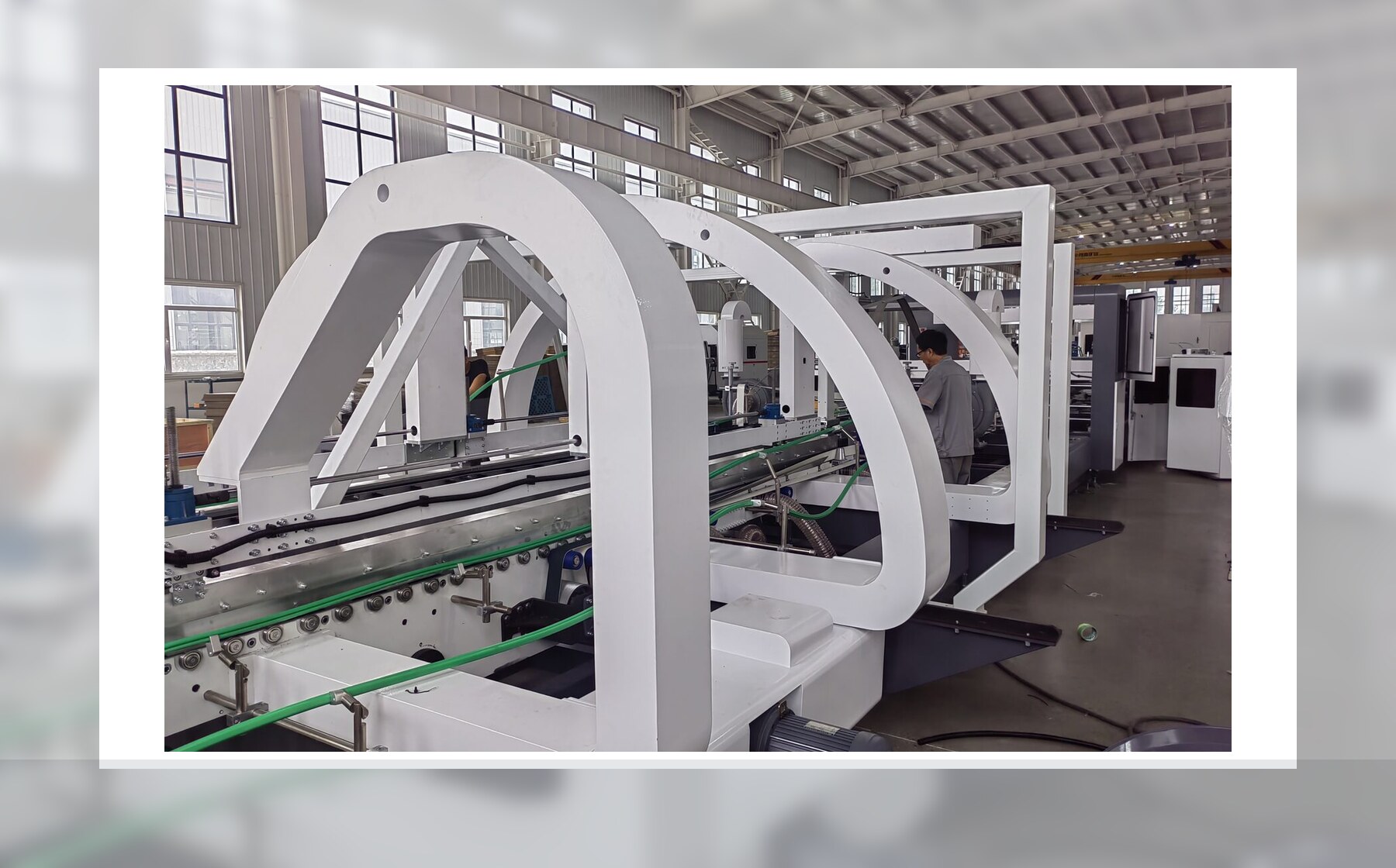 Folder gluer machine in carton production workshop