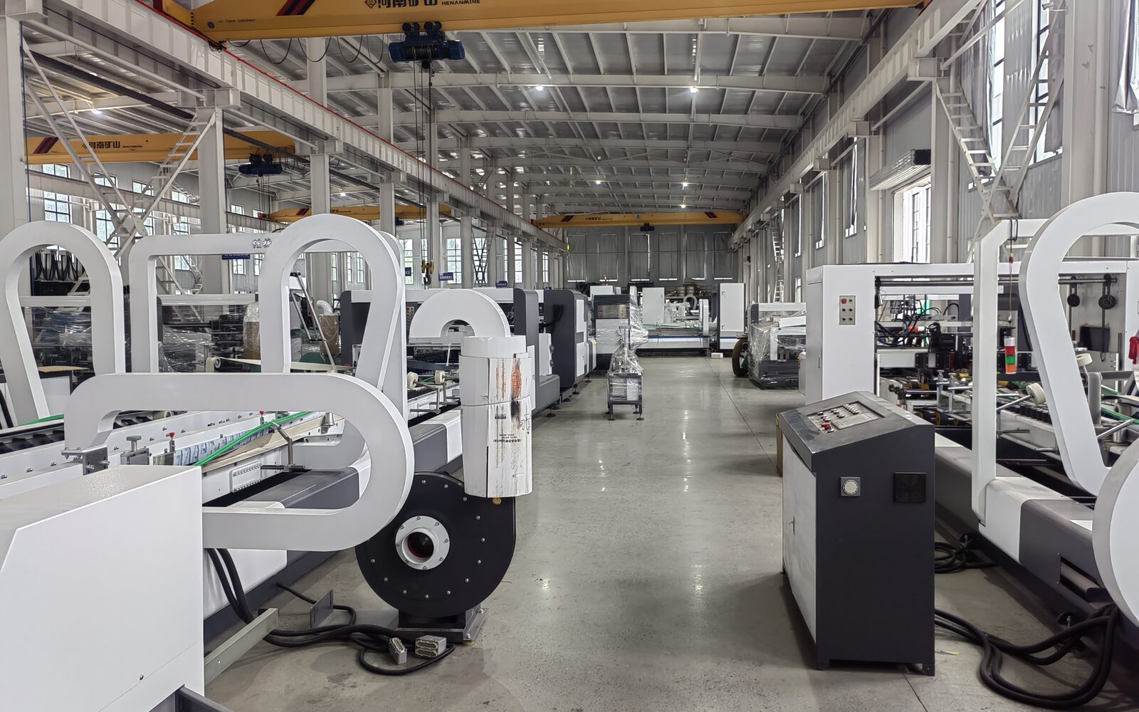 Carton folder gluer and stitcher machines in workshop